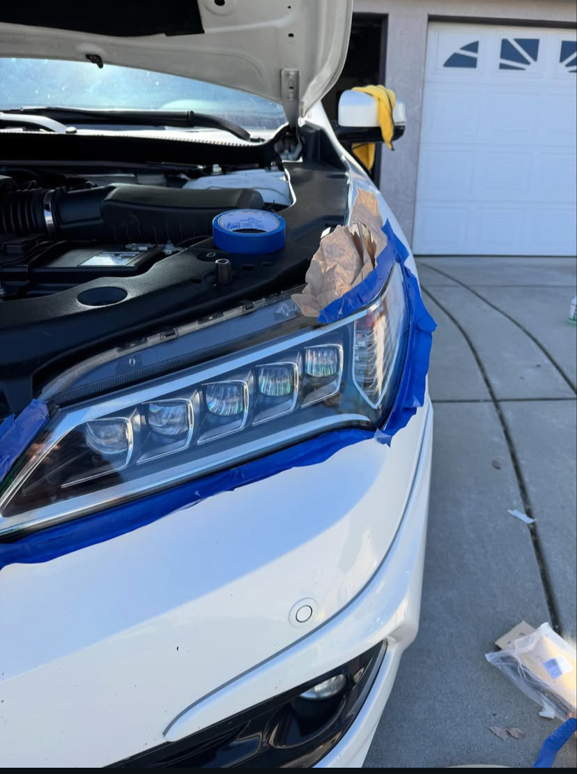 White Acura — right headlight after restoration, crystal clear